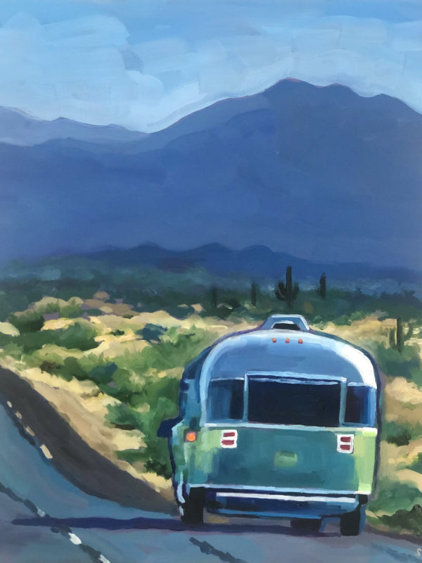 airstream trailer on highway by mountains