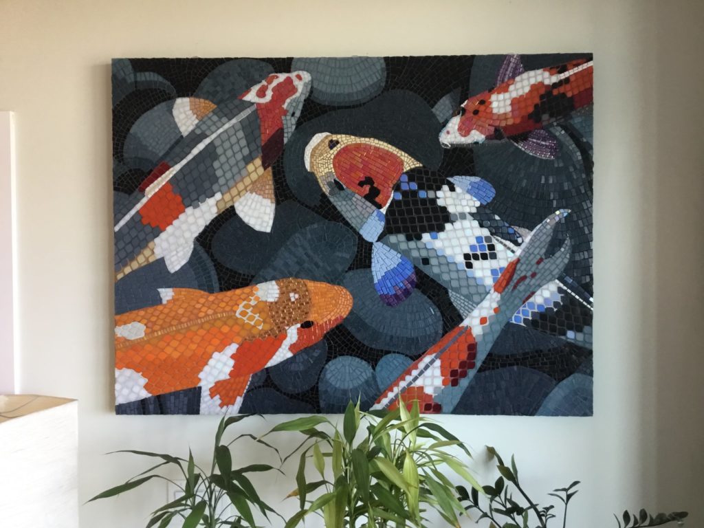 Large koi mosaic on wall of home