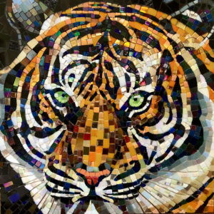 A glass mosaic of a tiger with bright green eyes